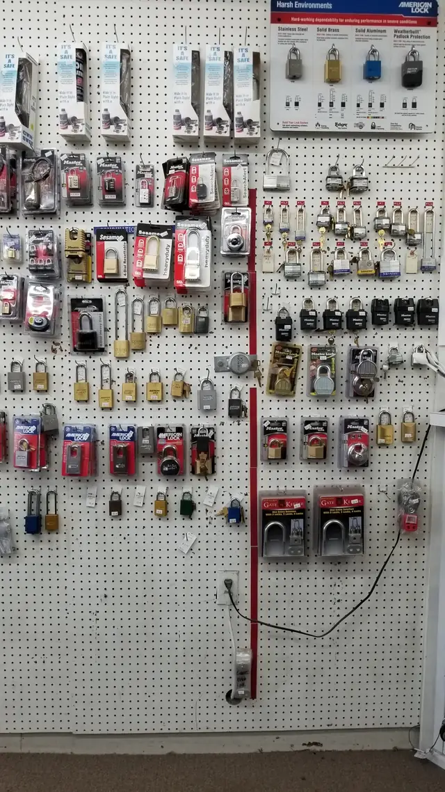 The full padlock retail wall at Mount's, rows of padlocks hung on pegboard